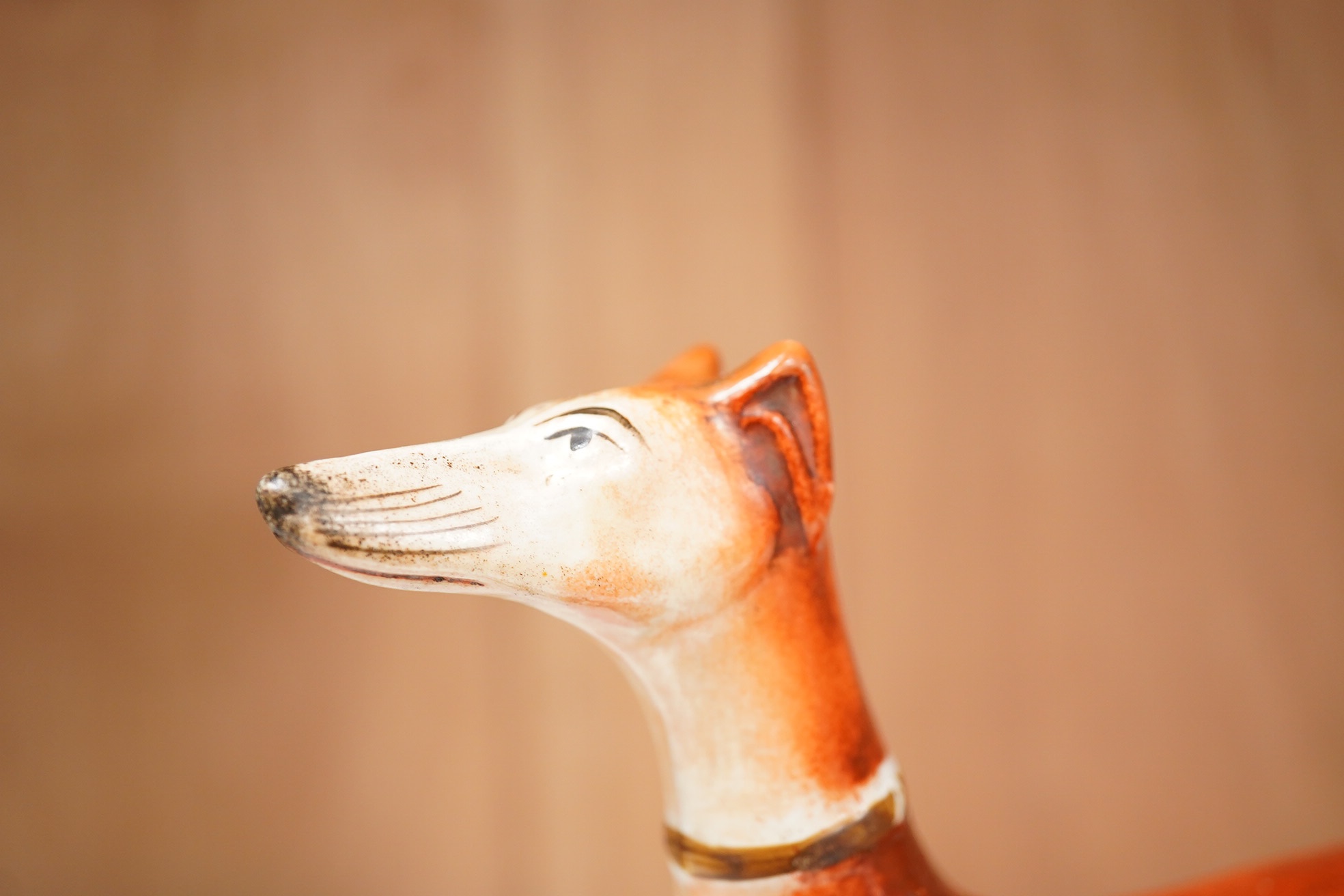 Three graduated Staffordshire pottery greyhounds and two others, longest 19cm (5). Condition - restored